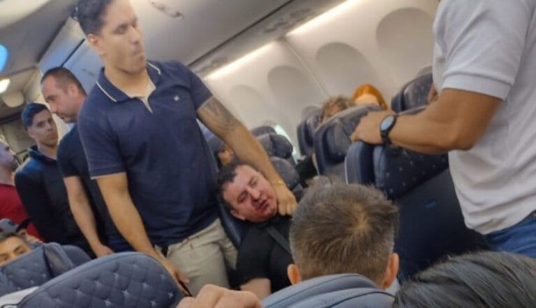 A passenger on board a flight from flight from Brazil to Panama was  severely beaten after he tried to open the plane's emergency door in mid-flight