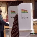 A picture circulating on social media captures the member of parliament for Nhyiaeso constituency, Stephen Amoah, peeping at the ballot paper of a female voter casting her vote.