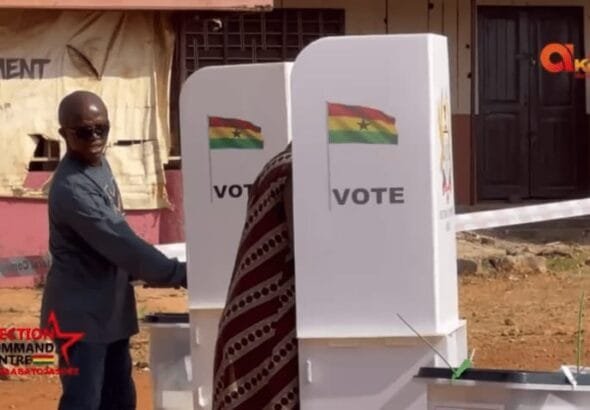 A picture circulating on social media captures the member of parliament for Nhyiaeso constituency, Stephen Amoah, peeping at the ballot paper of a female voter casting her vote.